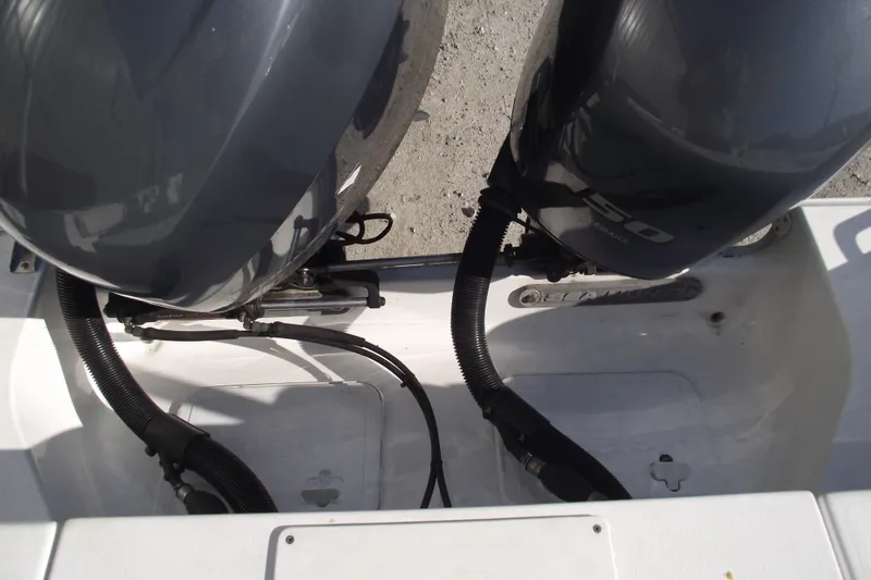 Slide: The Image of 2014 Sea Hunt Gamefish 25 boat with dual Yamaha 150 outboard engines. - 36