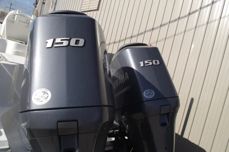 Slide: The Image of Twin Yamaha 150 outboard engines on a 2014 Sea Hunt Gamefish 25 boat. - 4