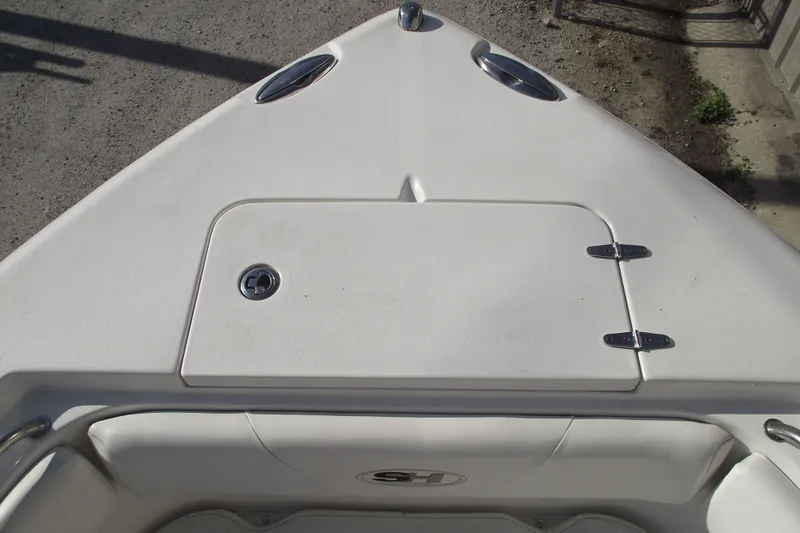 Slide: The Image of Bow view of 2014 Sea Hunt Gamefish 25 boat, featuring storage compartment. - 7