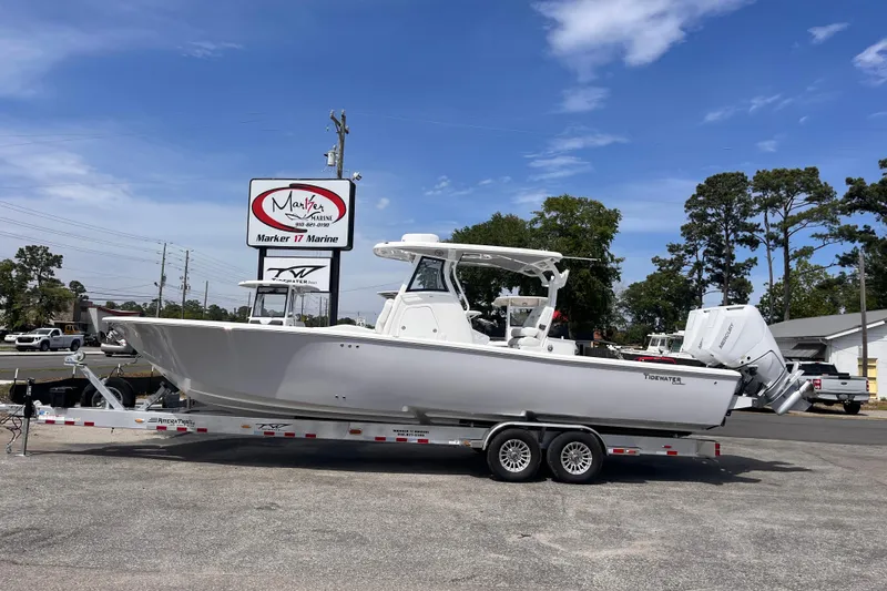 The Image of 2026 Tidewater 3100 Carolina Bay boat on trailer at Marker 17 Marine dealership. - 1