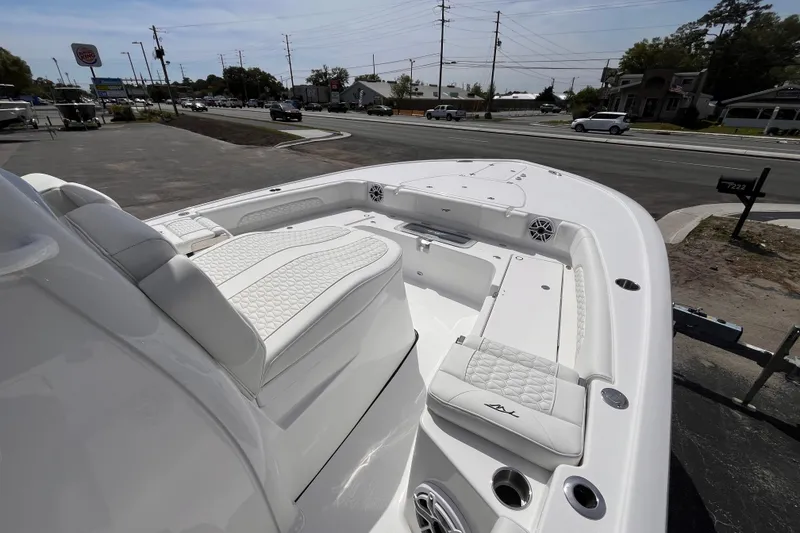 Slide: The Image of 2026 Tidewater 3100 Carolina Bay boat with white seating and sleek design. - 14