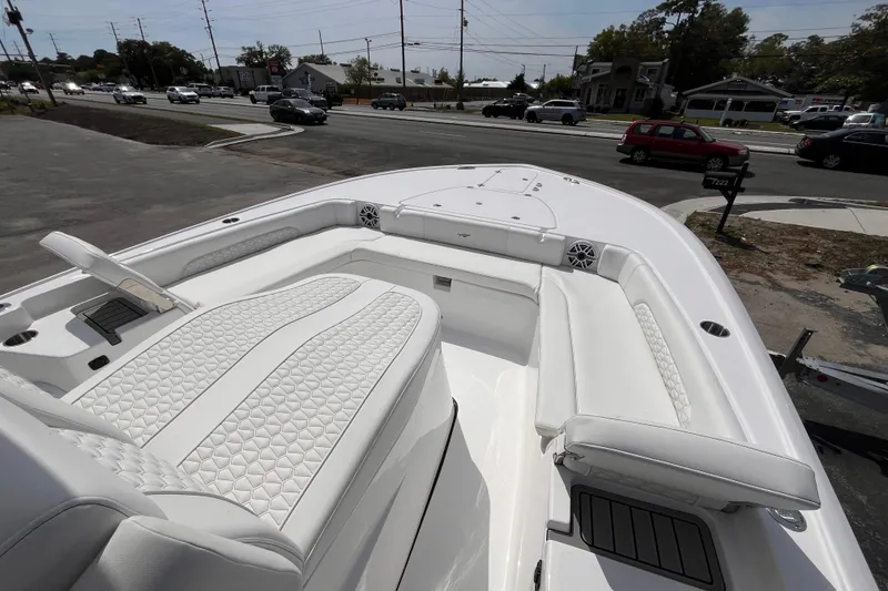 Slide: The Image of 2026 Tidewater 3100 Carolina Bay boat with luxurious white seating and modern design. - 15