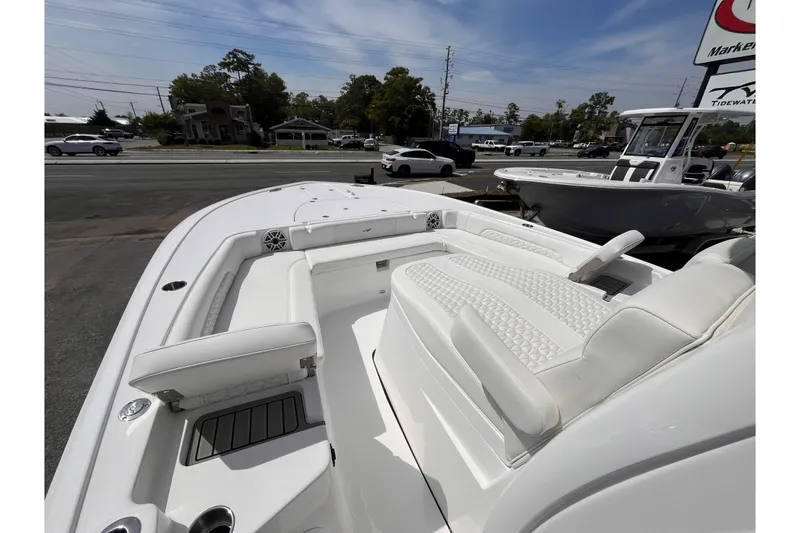 Slide: The Image of 2026 Tidewater 3100 Carolina Bay boat with luxurious white seating and modern design. - 17