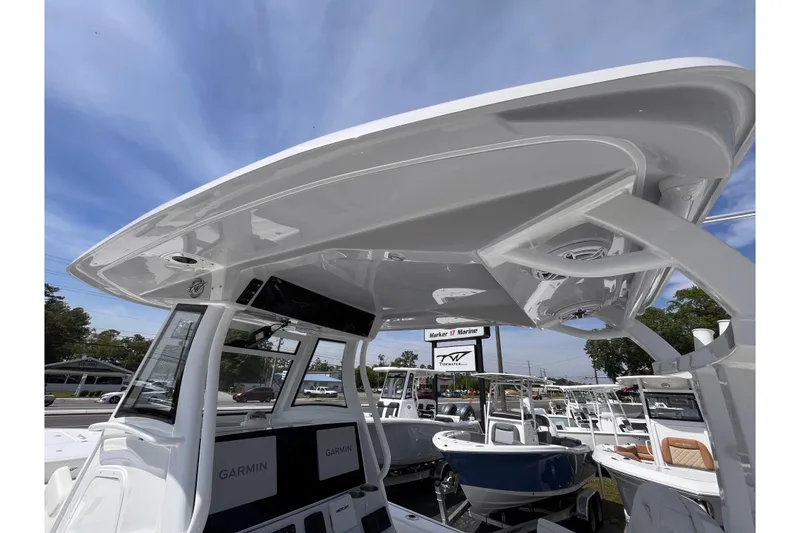 Slide: The Image of 2026 Tidewater 3100 Carolina Bay boat with Garmin electronics, displayed at a marine dealership. - 20