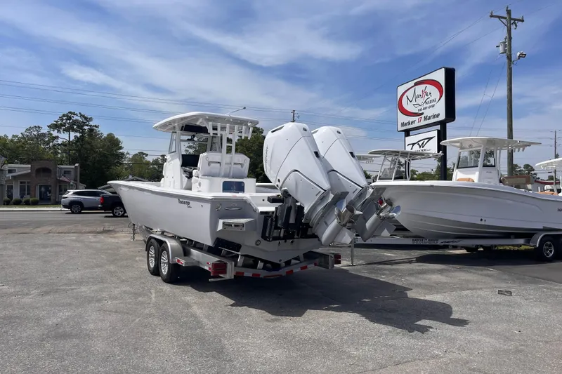 Slide: The Image of 2026 Tidewater 3100 Carolina Bay boat on trailer at Marker 17 Marine dealership. - 4