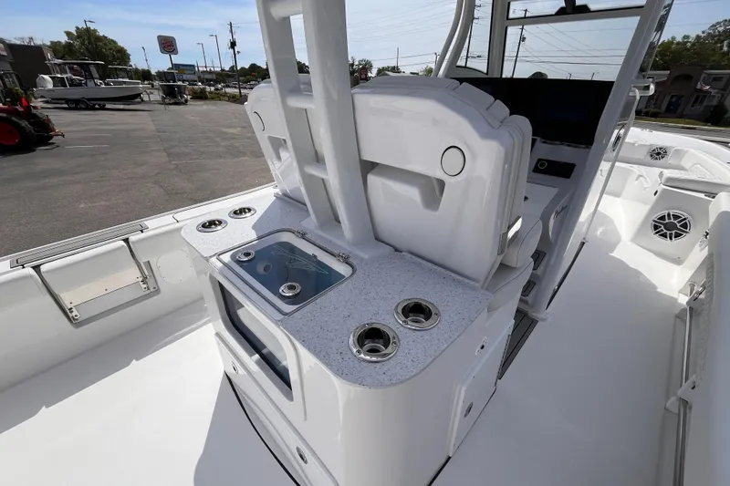 Slide: The Image of 2026 Tidewater 3100 Carolina Bay boat interior with sleek white console and cup holders. - 9