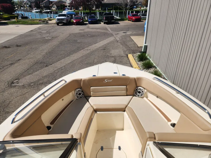 Slide: The Image of Scout 255 Dorado 2022 boat with beige interior at dock. - 10