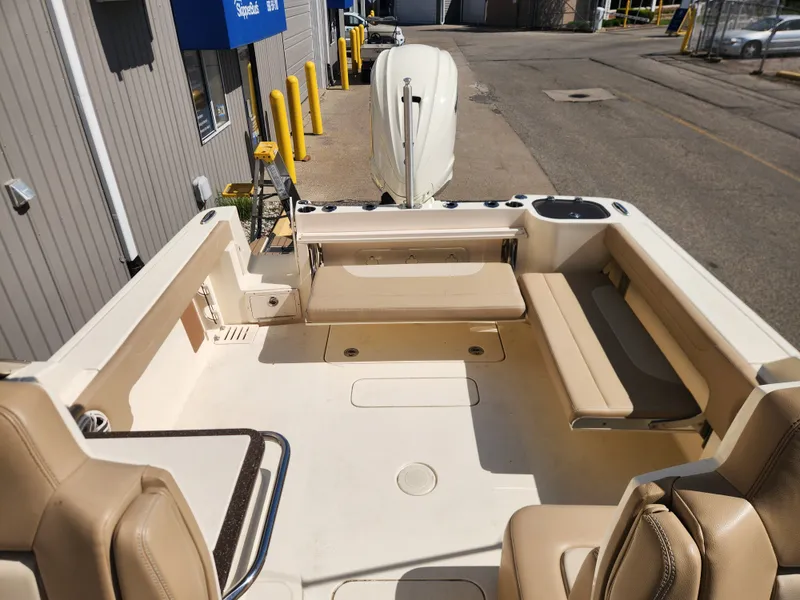 Slide: The Image of Interior of a 2022 Scout 255 Dorado boat with seating area. - 11