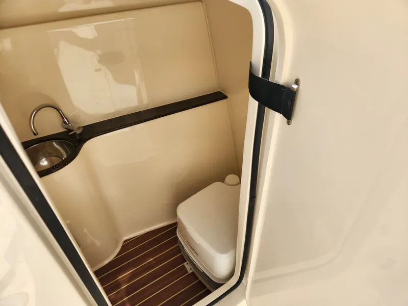 Slide: The Image of Interior of 2022 Scout 255 Dorado featuring sink and toilet. - 18