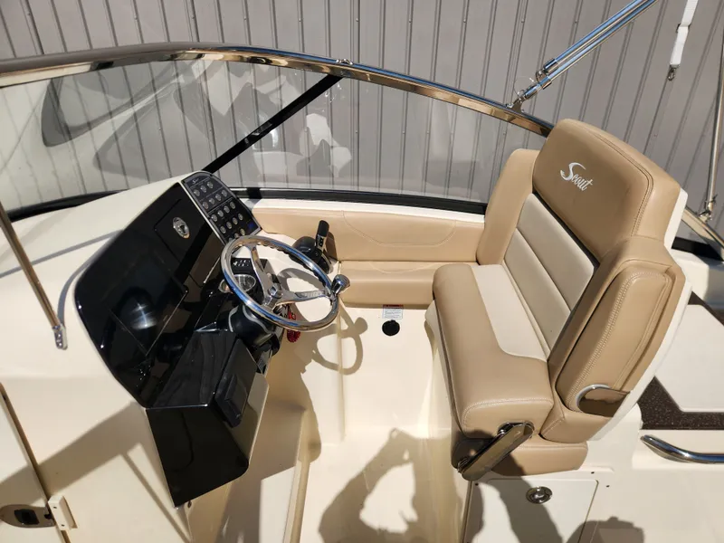 Slide: The Image of Interior of a 2022 Scout 255 Dorado boat with helm console. - 19