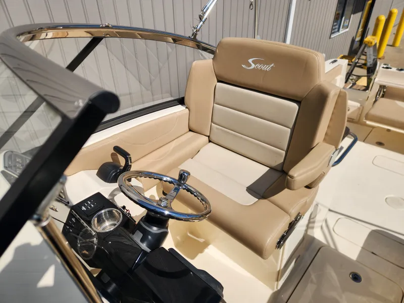 Slide: The Image of Interior of 2022 Scout 255 Dorado with beige seat and steering. - 21