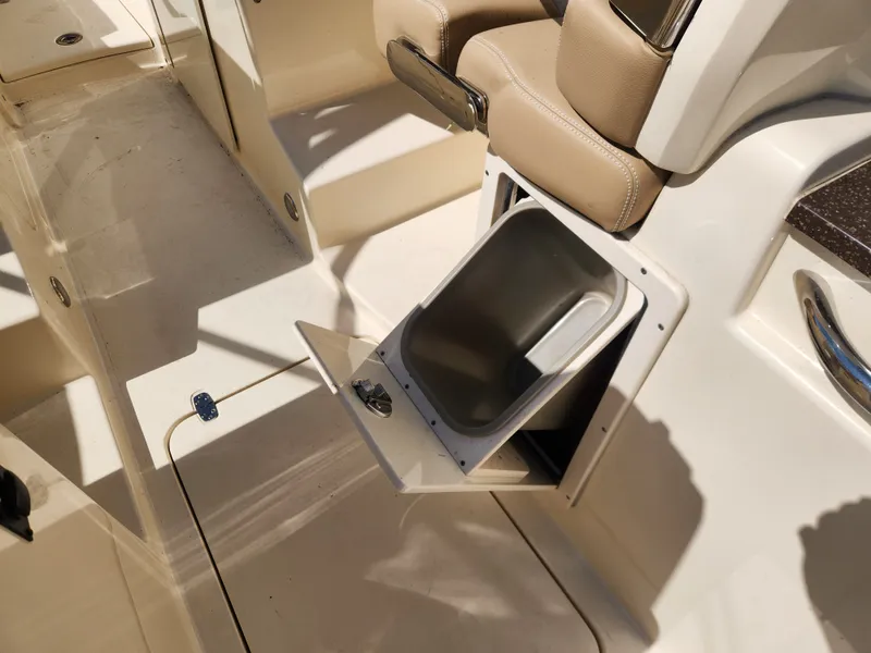 Slide: The Image of Scout 255 Dorado 2022 with built-in trash bin in cockpit. - 27
