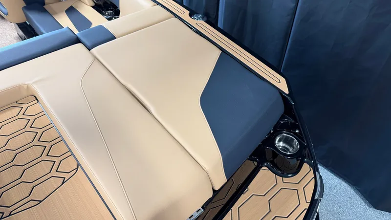 Slide: The Image of The image shows the sleek beige and black upholstery design of the 2027 MasterCraft NXT20. - 14