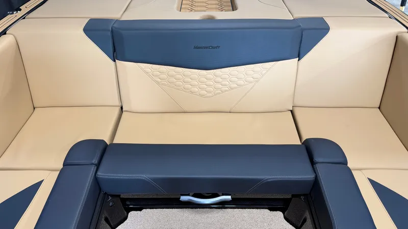 Slide: The Image of The image shows the luxurious interior of a MasterCraft NXT20 boat with beige and blue upholstery. - 27