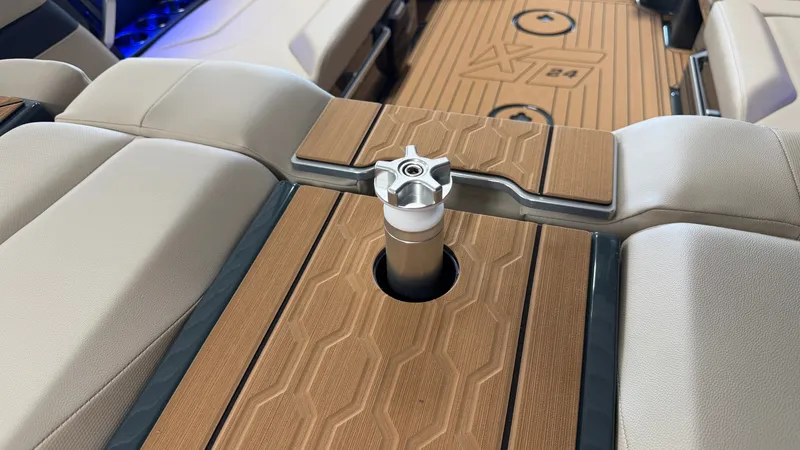 Slide: The Image of The image shows the interior of a MasterCraft XT24 boat with sleek seating and stylish flooring. - 23
