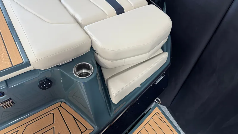 Slide: The Image of The 2027 MasterCraft XT24 features a luxurious padded seat with an integrated cup holder. - 17
