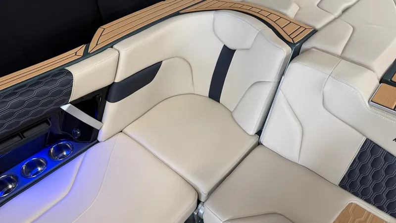 Slide: The Image of The 2027 MasterCraft XT24 features luxurious interior with cream upholstery and stylish detailing. - 35