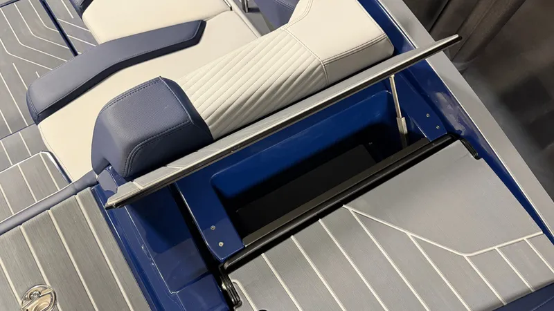 Slide: The Image of The image shows the stylish interior of a MasterCraft X23 boat with blue and white seating. - 19