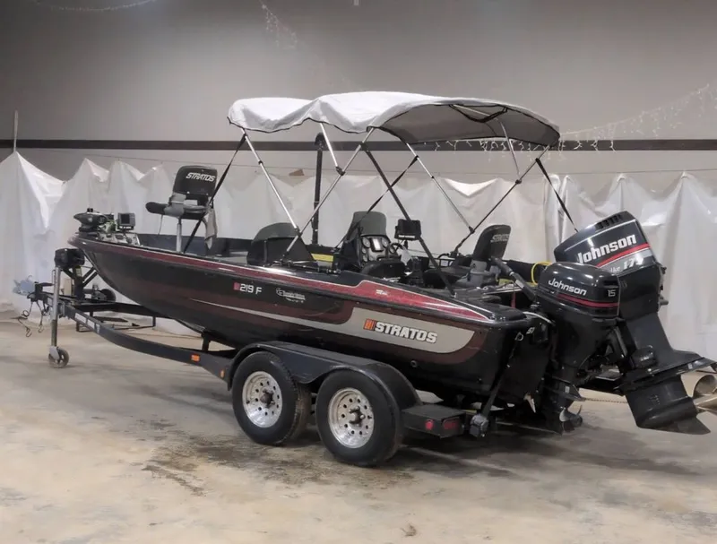 Slide: The Image of 1997 Stratos 219 F boat with Johnson outboard motor. - 2