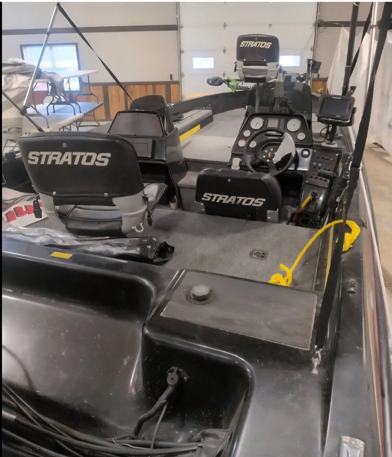 Slide: The Image of Interior of a 1997 Stratos 219 F boat with steering console. - 8
