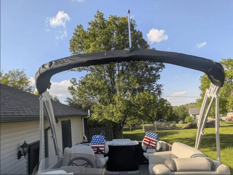 Slide: The Image of Sylvan Mirage 820 pontoon boat 2022 parked in backyard. - 1