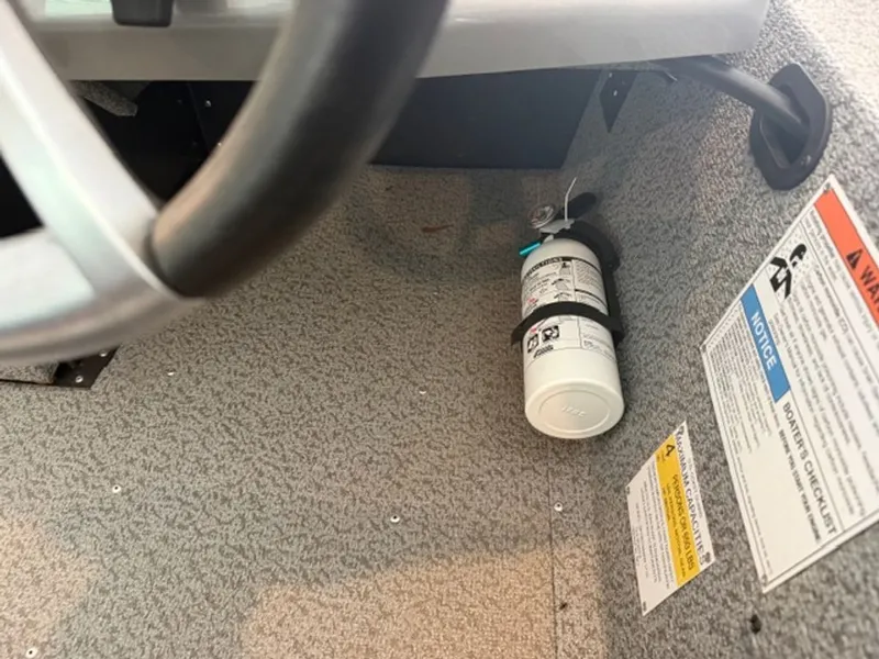Slide: The Image of Fire extinguisher mounted under steering wheel in 2022 G3 Sportsman boat. - 16