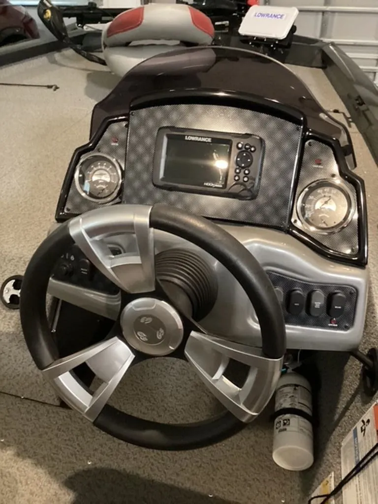 Slide: The Image of 2022 G3 Sportsman boat dashboard with steering wheel and instruments. - 5