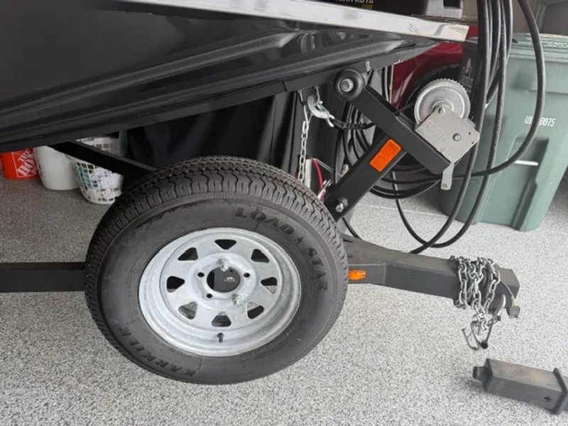 Slide: The Image of 2022 G3 Sportsman trailer with spare tire and chains. - 7