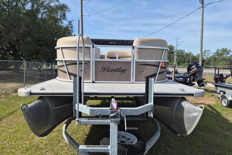 The Image of 2004 Bentley Pontoons 180 CRUISE on trailer, parked outdoors. - 1