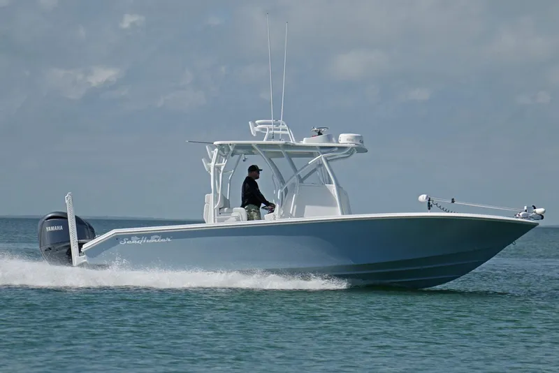 Slide: The Image of Manufacturer Provided Image: 2025 SeaHunter 28 Floridian boat cruising on open water. - 2