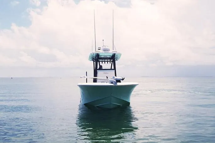 Slide: The Image of Manufacturer Provided Image: SeaHunter 28 Floridian 2025 boat on calm ocean waters under cloudy sky. - 3