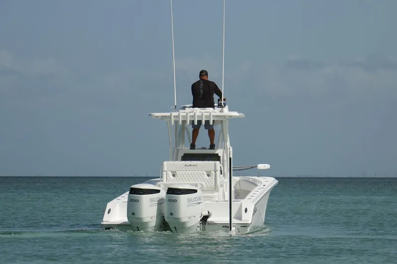 Slide: The Image of Manufacturer Provided Image: 2025 SeaHunter 28 Floridian boat with dual engines on calm water. - 4