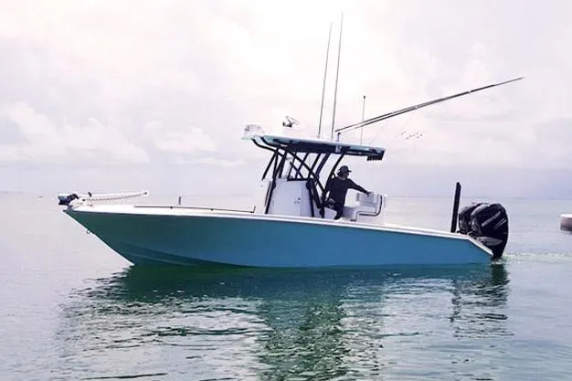 Slide: The Image of Manufacturer Provided Image: 2025 SeaHunter 28 Floridian boat on calm water, side view. - 5