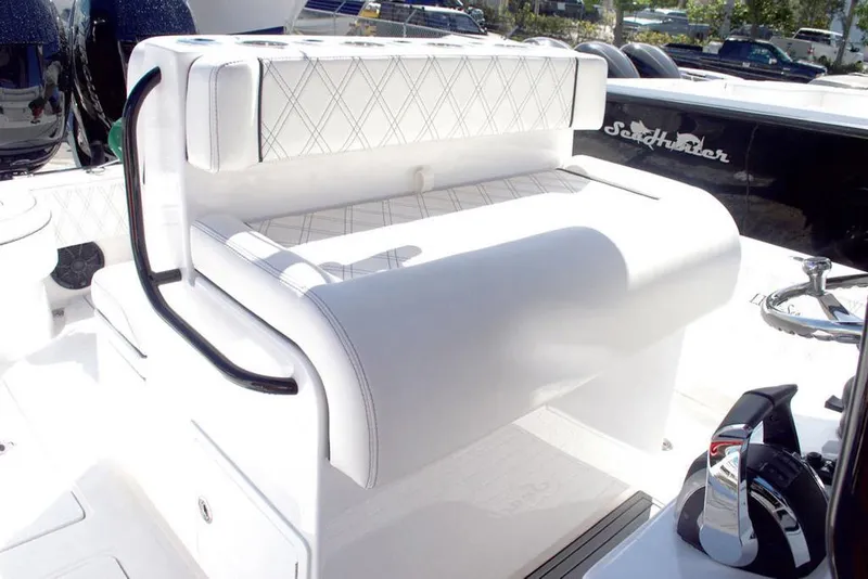 Slide: The Image of Manufacturer Provided Image: 2025 SeaHunter 28 Floridian boat interior with white cushioned seating. - 8