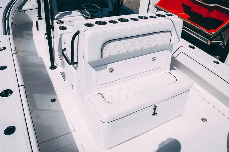 Slide: The Image of Manufacturer Provided Image: 2025 SeaHunter 28 Floridian boat interior with white seating and storage compartments. - 9