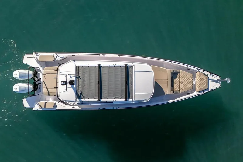 Slide: The Image of Overhead view of 2026 Axopar 37 XC Cross Cabin boat on water. - 1