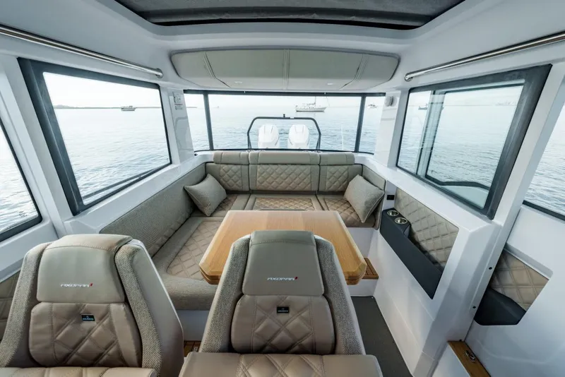 Slide: The Image of Interior of 2026 Axopar 37 XC Cross Cabin with luxurious seating and panoramic windows. - 9