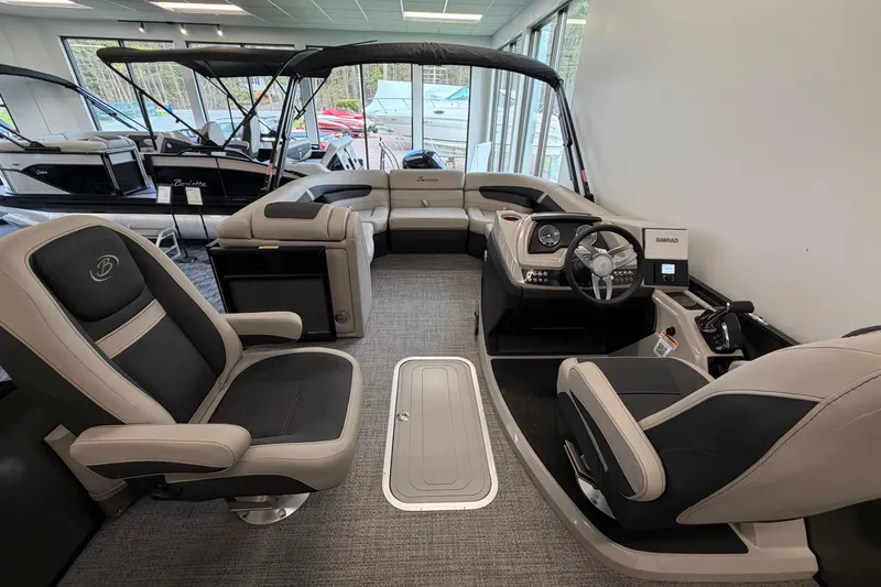 Slide: The Image of Interior of 2025 Barletta Cabrio 22UC pontoon boat with luxurious seating and modern dashboard. - 11