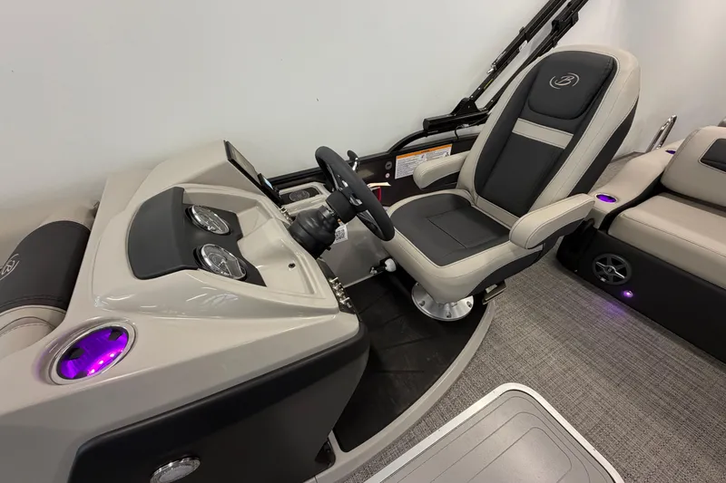 Slide: The Image of 2025 Barletta Cabrio 22UC boat interior with modern helm and comfortable seating. - 13