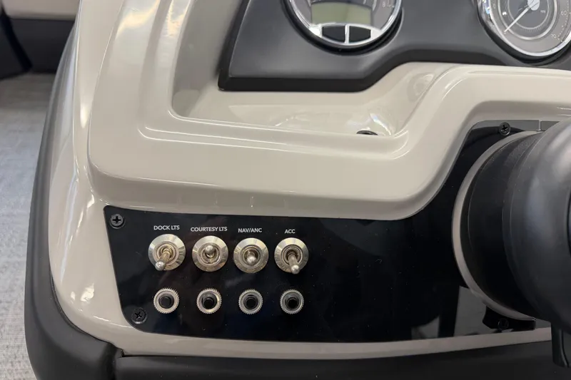 Slide: The Image of Control panel of 2025 Barletta Cabrio 22UC boat with switches for lights and accessories. - 14