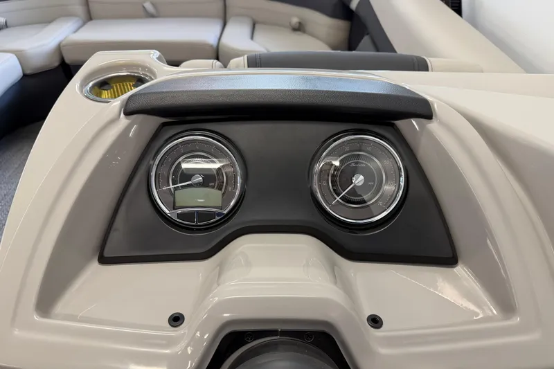 Slide: The Image of Dashboard of 2025 Barletta Cabrio 22UC boat with gauges and seating in background. - 16