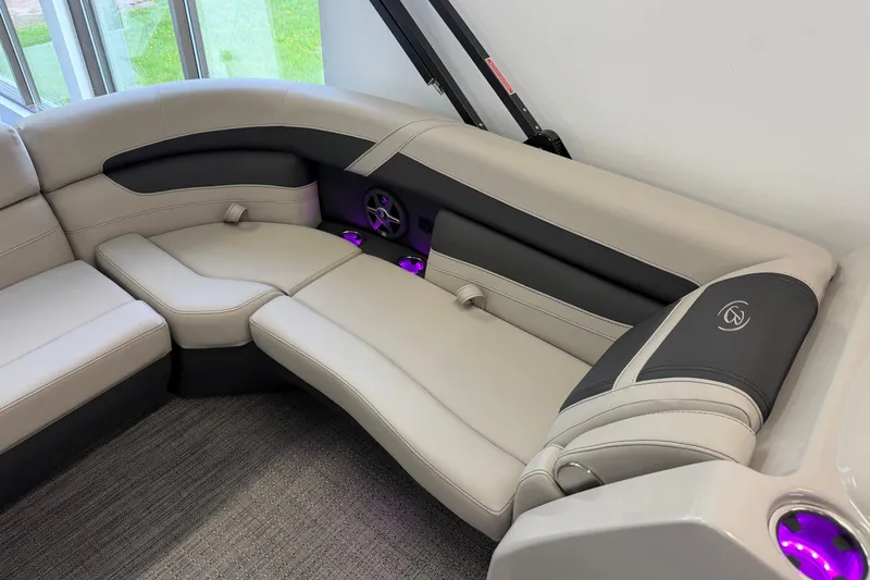 Slide: The Image of Luxurious seating in the 2025 Barletta Cabrio 22UC pontoon boat with ambient lighting. - 24