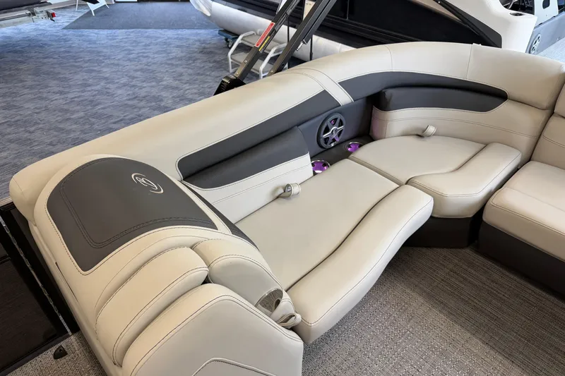 Slide: The Image of Luxurious seating in the 2025 Barletta Cabrio 22UC pontoon boat, featuring elegant upholstery and cup holders. - 25