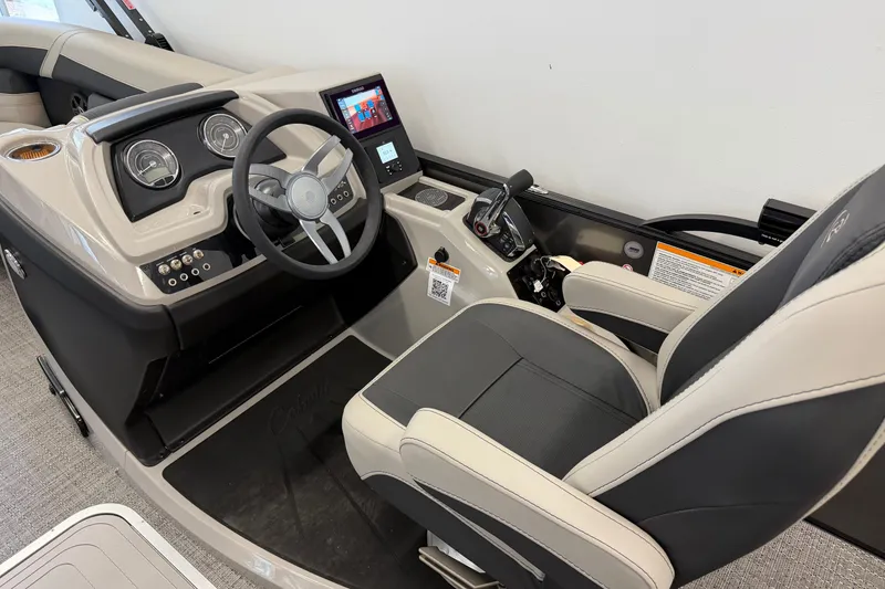 Slide: The Image of 2025 Barletta Cabrio 22UC boat cockpit with modern steering and control panel. - 28