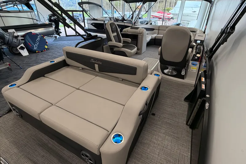 Slide: The Image of 2025 Barletta Cabrio 22UC pontoon boat interior with luxurious seating and modern design. - 5