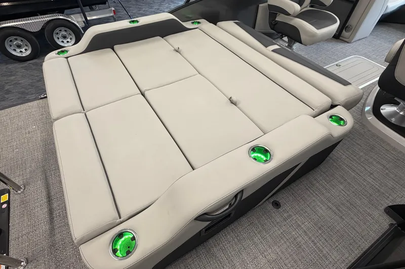 Slide: The Image of 2025 Barletta Cabrio 22UC boat interior with cushioned seating and illuminated cup holders. - 8