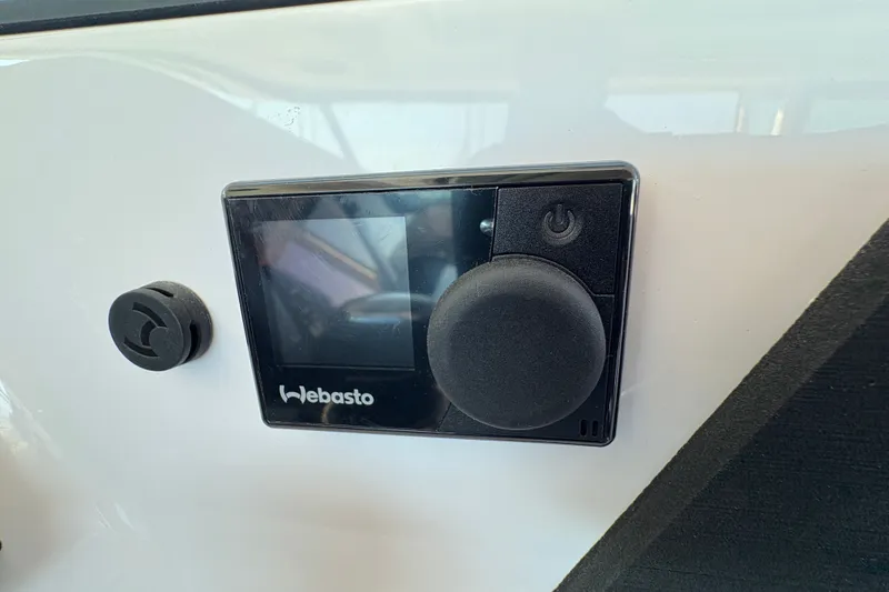 Slide: The Image of Webasto control panel on 2026 Axopar 37 XC Cross Cabin boat dashboard. - 40