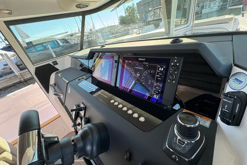 Slide: The Image of Helm of 2026 Axopar 37 XC Cross Cabin with advanced navigation system. - 41