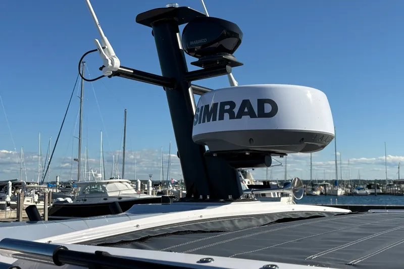 Slide: The Image of 2026 Axopar 37 XC Cross Cabin with Simrad radar at marina. - 11