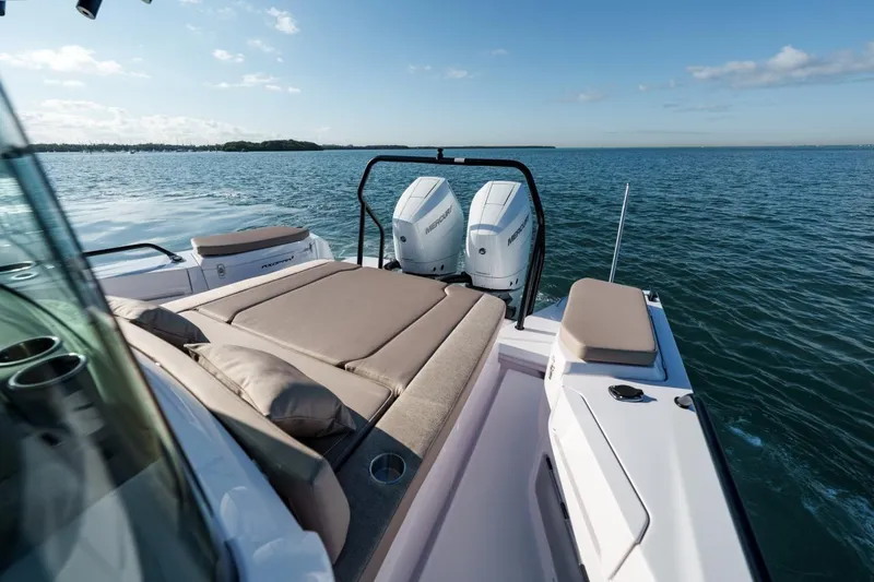 Slide: The Image of 2026 Axopar 37 XC Cross Cabin boat with twin engines on open water. - 5